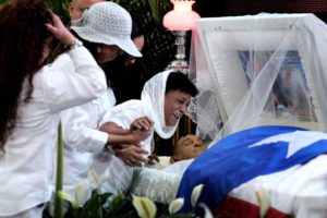 Maria Matias cries over the body of her son, former Puerto Rican welterweight boxing champion Hector "Macho" Camacho, as he lies in state during his wake in San Juan